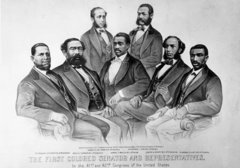Thượng nghị sĩ Hoa Kỳ Hiram Revels (trái) cùng các Dân biểu, từ thứ hai bên trái Benjamin Turner, Robert De Large, Josiah Walls, Jefferson Long, Joseph Rainey và Robert Brown Elliot.