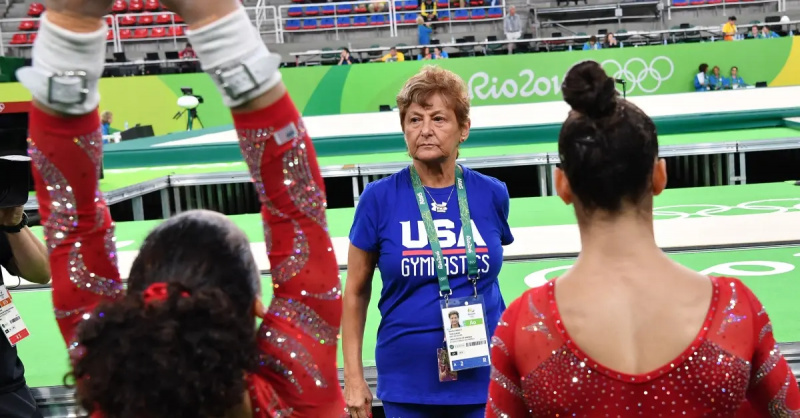   Bela Karolyi's wife, Marta, coaching gymnasts.