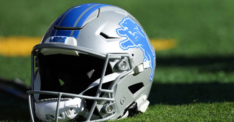 Někteří fanoušci Detroit Lions drží tato znamení, aby se mohli rozzuřit na třetím sestřelení