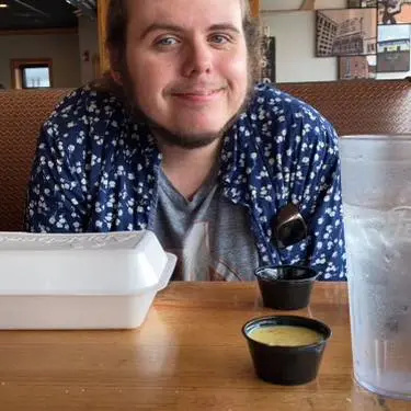 Тоня Хаддікс's son, Justin Range