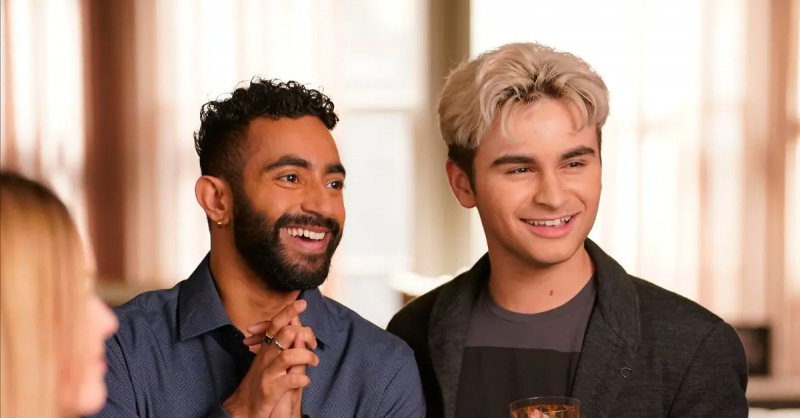 (ל-ר): דני's husband and Danny smiling at Javi's birthday
